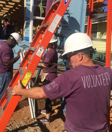 Meridian Safe Bank employees working at Urban Ministries soup kitchen